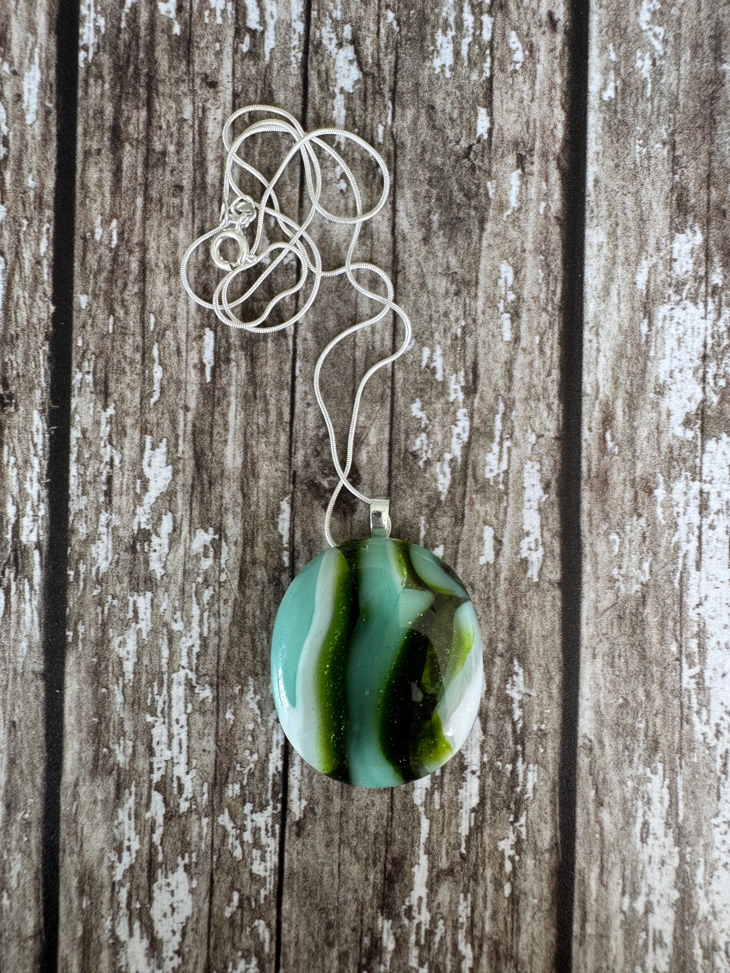 Shimmering blues and greens Glass Pendant
